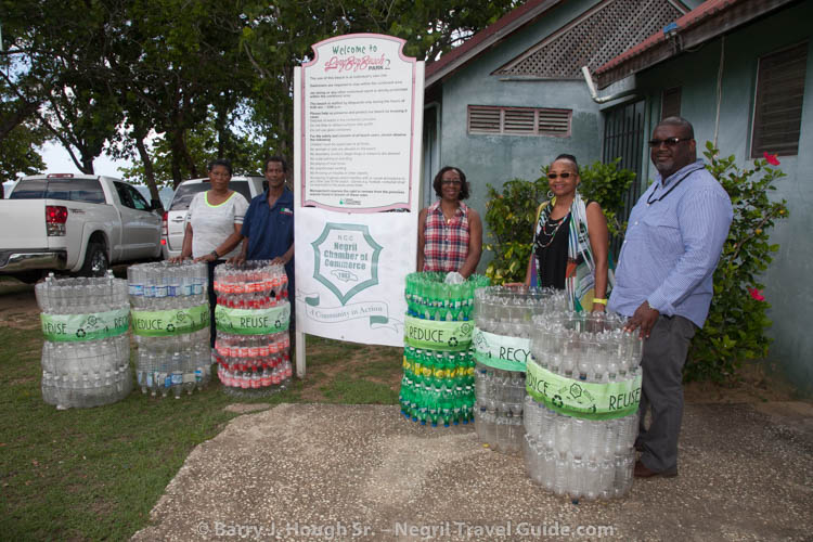 The Negril Chamber Of Commerce President, Lee Issa, donates six garbage bins to UDC at Long Bay Beach Park