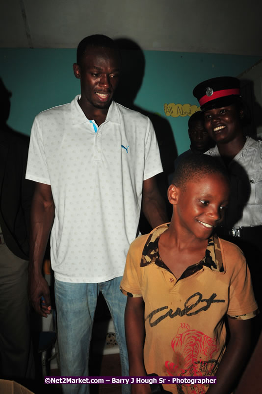 Usain Bolt of Jamaica - The Fastest Man In The World  - Usain Bolt Homecoming Celebrations - Press Conference at the Grand Bahia Principe &amp; Sherwood Content - Waldensia Primary School - Photographs by Net2Market.com - Barry J. Hough Sr. Photojournalist/Photograper - Photographs taken with a Nikon D300 - Negril Travel Guide, Negril Jamaica WI - http://www.negriltravelguide.com - info@negriltravelguide.com...!